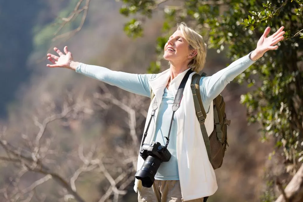 Osteoarthritis Senior Female on top of mountain